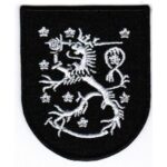 Leijona - musta kangasmerkki.